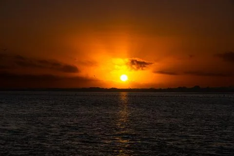 Sunset over the sea Stock Photos