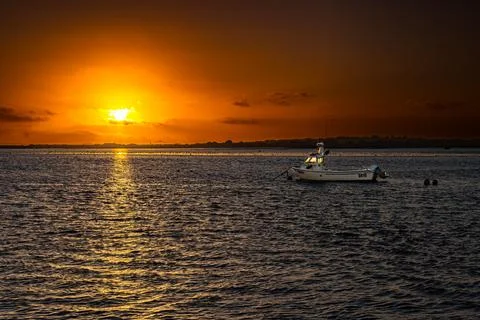 Sunset over the sea Stock Photos