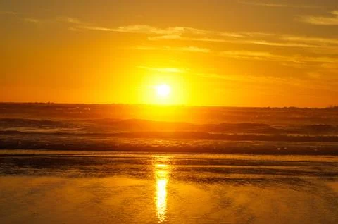 Sunset over the sea Stock Photos