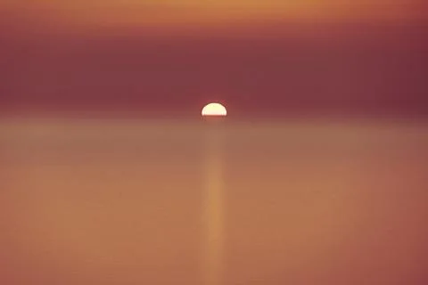 Sunset over sea Stock Photos