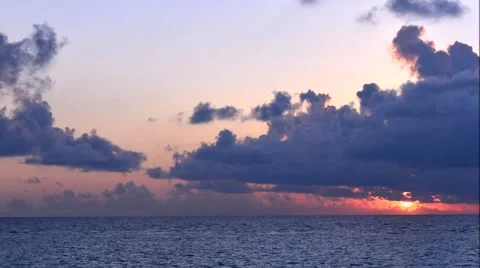 Sunset over the sea. Rays of the sun through the clouds. Stock Footage 64992401