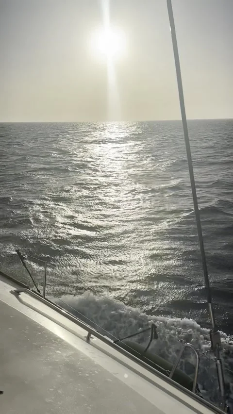 Sunset Over the Sea from a Sailing Catamaran Stock Footage 336965006