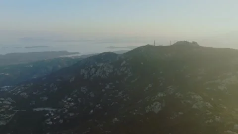 Sunset over the sea seen from a mountain Stock Footage 231811456