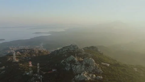 Sunset over the sea seen from a mountain Stock Footage 231811635