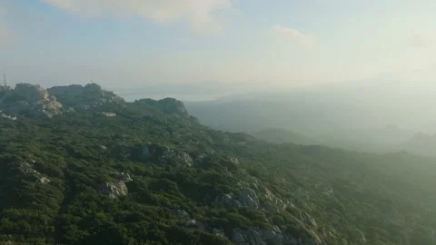 Sunset over the sea seen from a mountain Stock Footage 231815026