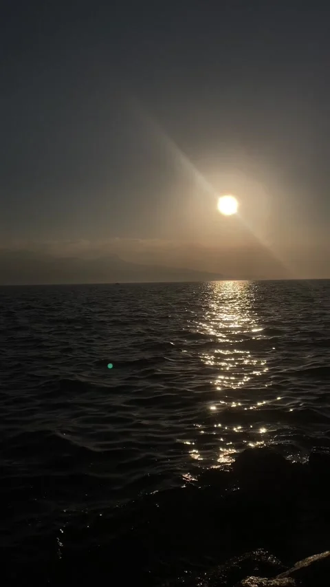 Sunset over the Sea with slow motion waves (Vertical) Stock Footage 239481901