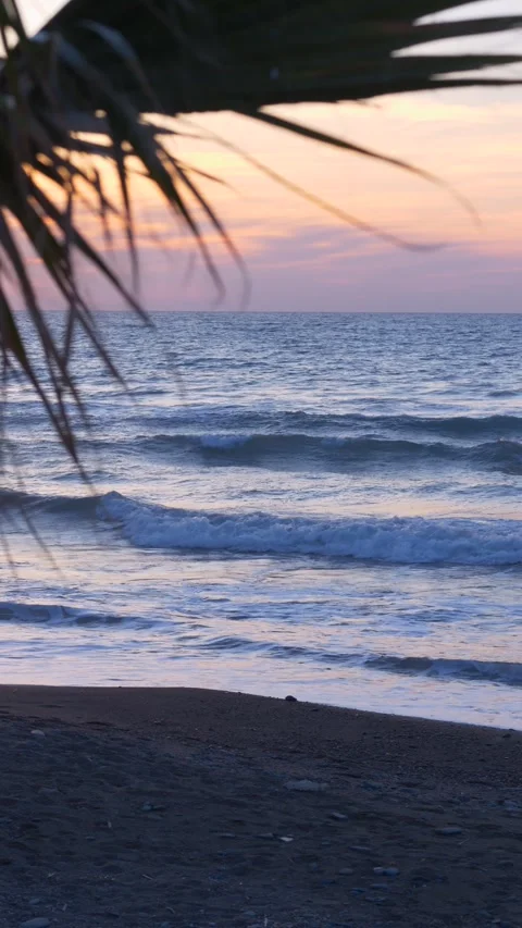 Sunset over the sea with soft waves, creating relaxing atmosphere for travel Stock Footage 332896390