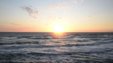 Sunset over the sea with strong wind and waves Stock Footage 83215873
