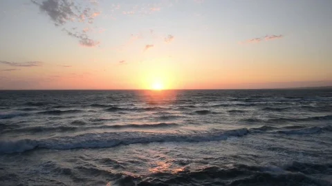 Sunset over the sea with strong wind and waves Stock Footage 83216357