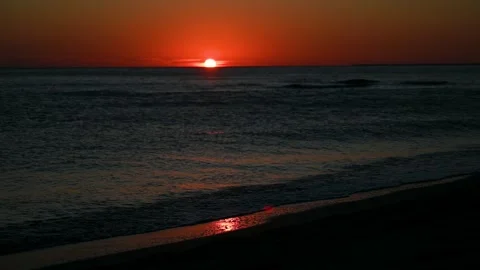 Sunset over the sea in summer. Sun is going down on horizon. Stock Footage 293207734