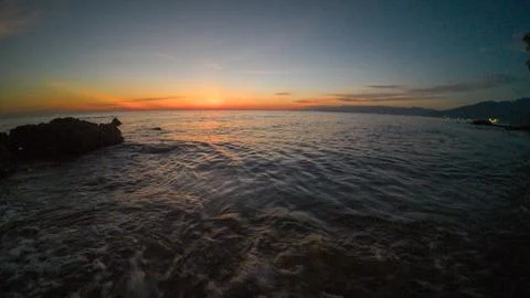 Sunset over the sea. The sun is reflected in the water. Fotos de archivo