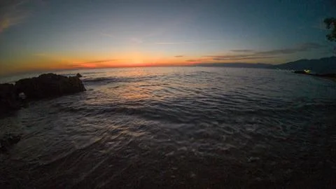 Sunset over the sea. The sun is reflected in the water. Stock Photos