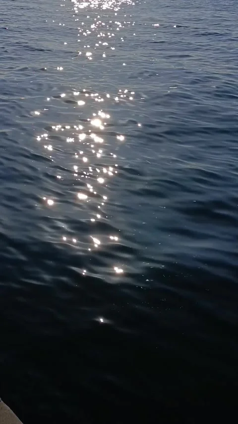 Sunset over the sea. The sun's glare on the sea waves Stock Footage 276944976