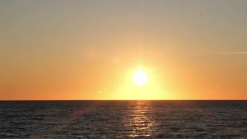 Sunset over sea surface. Ocean sunrise landscape without clouds Stock Footage 301892693