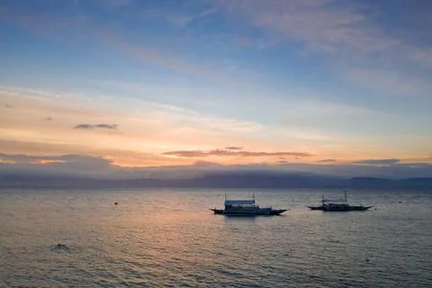 Sunset over the sea, top view. Seascape with boats. Stock Photos