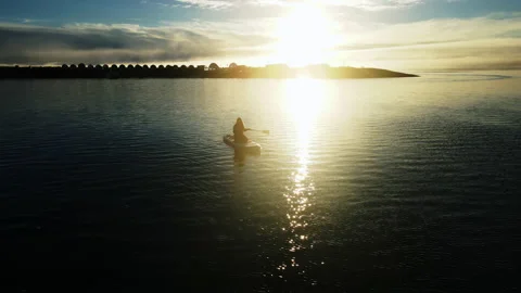 Sunset over the sea with two swans on the horizon. Stock Footage 229417977