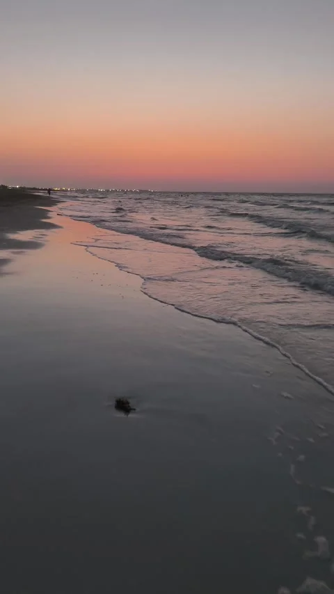 Sunset Over the Sea with Waves Breaking on the Shore – Vertical Video stock 341974351