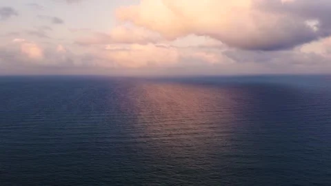 Sunset over seascape reflected on water drone aerial view Video stock 249537953