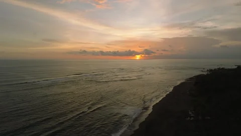 Sunset Over Serene Black Sand Beach, a tranquil spot for relaxation Stock Footage 280546732