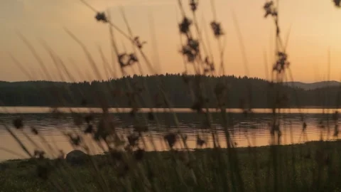 Sunset over Shiroka polyana dam (Wide meadow), Rodopi mountain, Bulgaria. Video stock 336895696