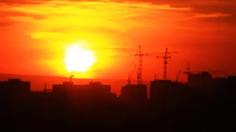 Sunset over a silhouette of a city Stock Footage 38015936