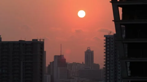Sunset over silhouette office building time lapse Stock Footage 48704533