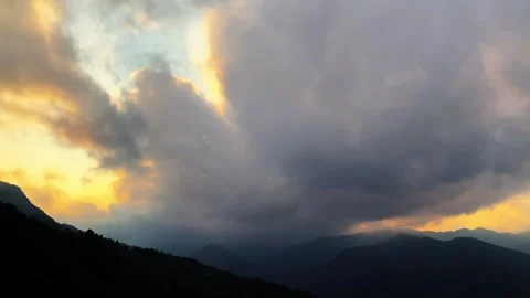 Sunset over silhouettes of mountain ranges in China Video stock 333442956