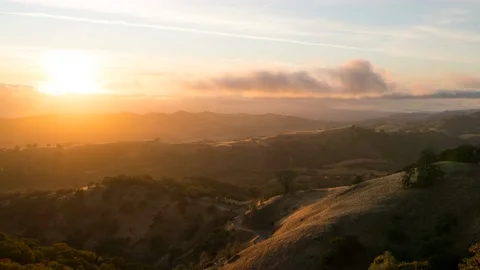 Sunset over Silicon valley observed from a mountain on a level of lower clouds Stock Footage