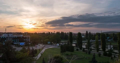 Sunset Over Small City River and a Bridge Over It, Car Traffic Transition From Stock Footage 67702566