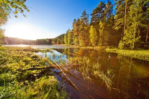 Sunset over small lake Stock Photos