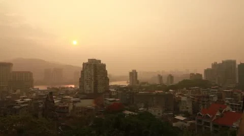 Sunset over a small town in Macau Video stock 12309061