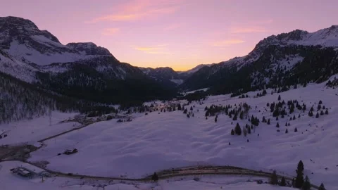 Sunset over the snow-capped Dolomites in the Italian Alps Stock Footage 233935489