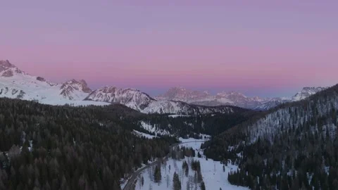 Sunset over the snow-capped Dolomites in the Italian Alps Stock Footage 233937730
