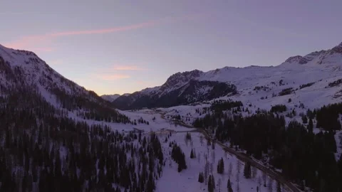 Sunset over the snow-capped Dolomites in the Italian Alps Stock Footage 233938746