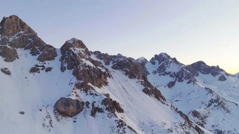 Sunset over the snow-capped Dolomites in the Italian Alps Stock Footage 233938992