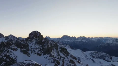 Sunset over the snow-capped Dolomites in the Italian Alps Stock Footage 233974082