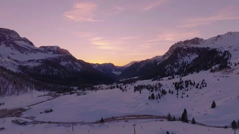 Sunset over the snow-capped Dolomites in the Italian Alps Stock Footage 233974473