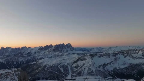 Sunset over the snow-capped Dolomites in the Italian Alps Stock Footage 233974486