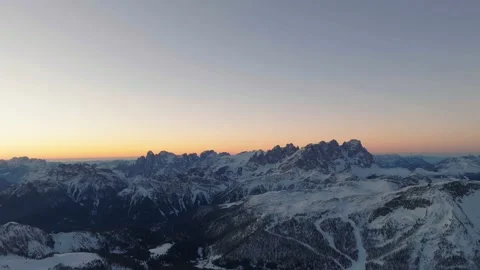 Sunset over the snow-capped Dolomites in the Italian Alps Stock Footage 233974717