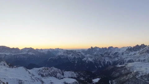 Sunset over the snow-capped Dolomites in the Italian Alps Stock Footage 233974759