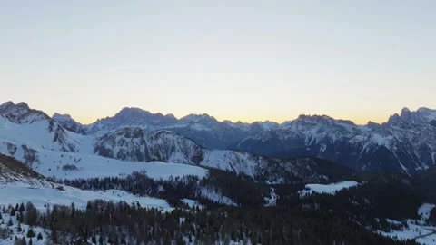 Sunset over the snow-capped Dolomites in the Italian Alps Stock Footage 233974913