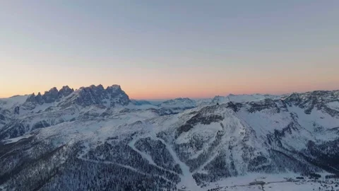 Sunset over the snow-capped Dolomites in the Italian Alps Stock Footage 233975030