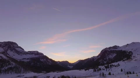 Sunset over the snow-capped Dolomites in the Italian Alps Stock Footage 233975578