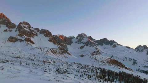 Sunset over the snow-capped Dolomites in the Italian Alps Stock Footage 233975951