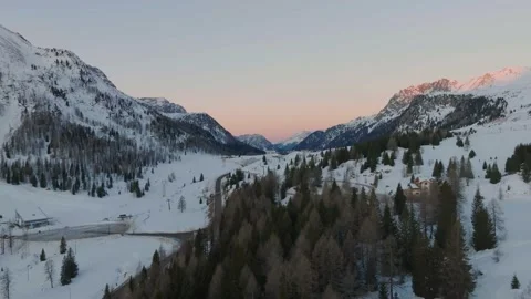 Sunset over the snow-capped Dolomites in the Italian Alps Stock Footage 233975980