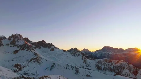 Sunset over the snow-capped Dolomites in the Italian Alps Stock Footage 233976136