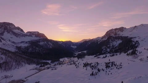 Sunset over the snow-capped Dolomites in the Italian Alps Video stock 233976242