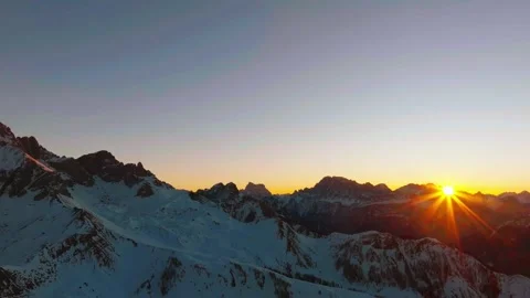 Sunset over the snow-capped Dolomites in the Italian Alps Stock Footage 233976368