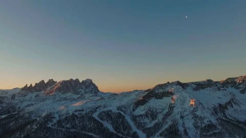 Sunset over the snow-capped Dolomites in the Italian Alps Stock Footage 233976598
