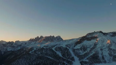 Sunset over the snow-capped Dolomites in the Italian Alps Stock Footage 233976797